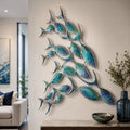 School of fish metal wall art with flowing marine movement and ocean colors printed on aluminum for coastal decor